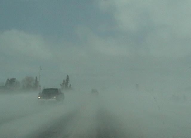 snowy foggy road